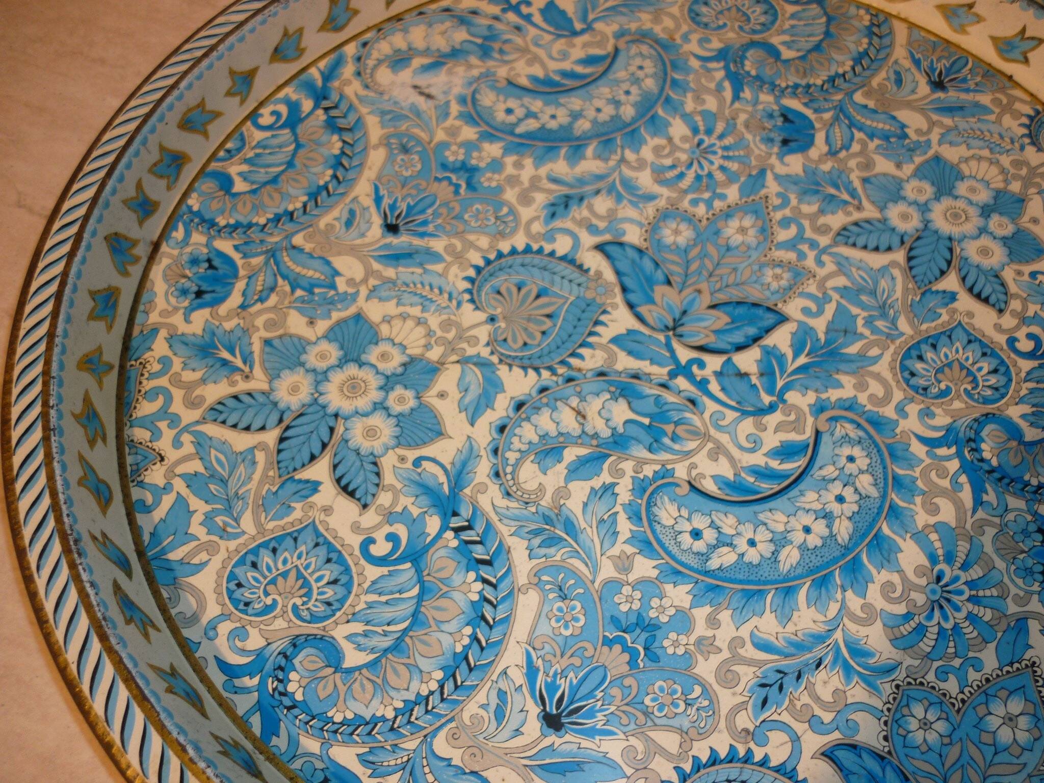 Blue cashmere round tray on white background.