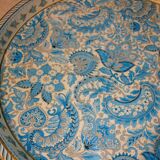 Blue cashmere round tray on white background.