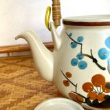 Vintage teapot in stoneware and wicker