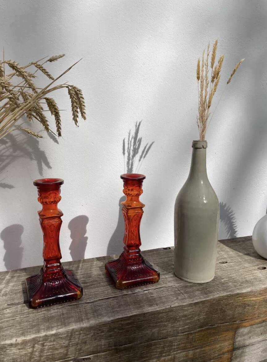 Pair of amber glass candlesticks