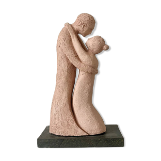 Couple statue entwined in grog clay