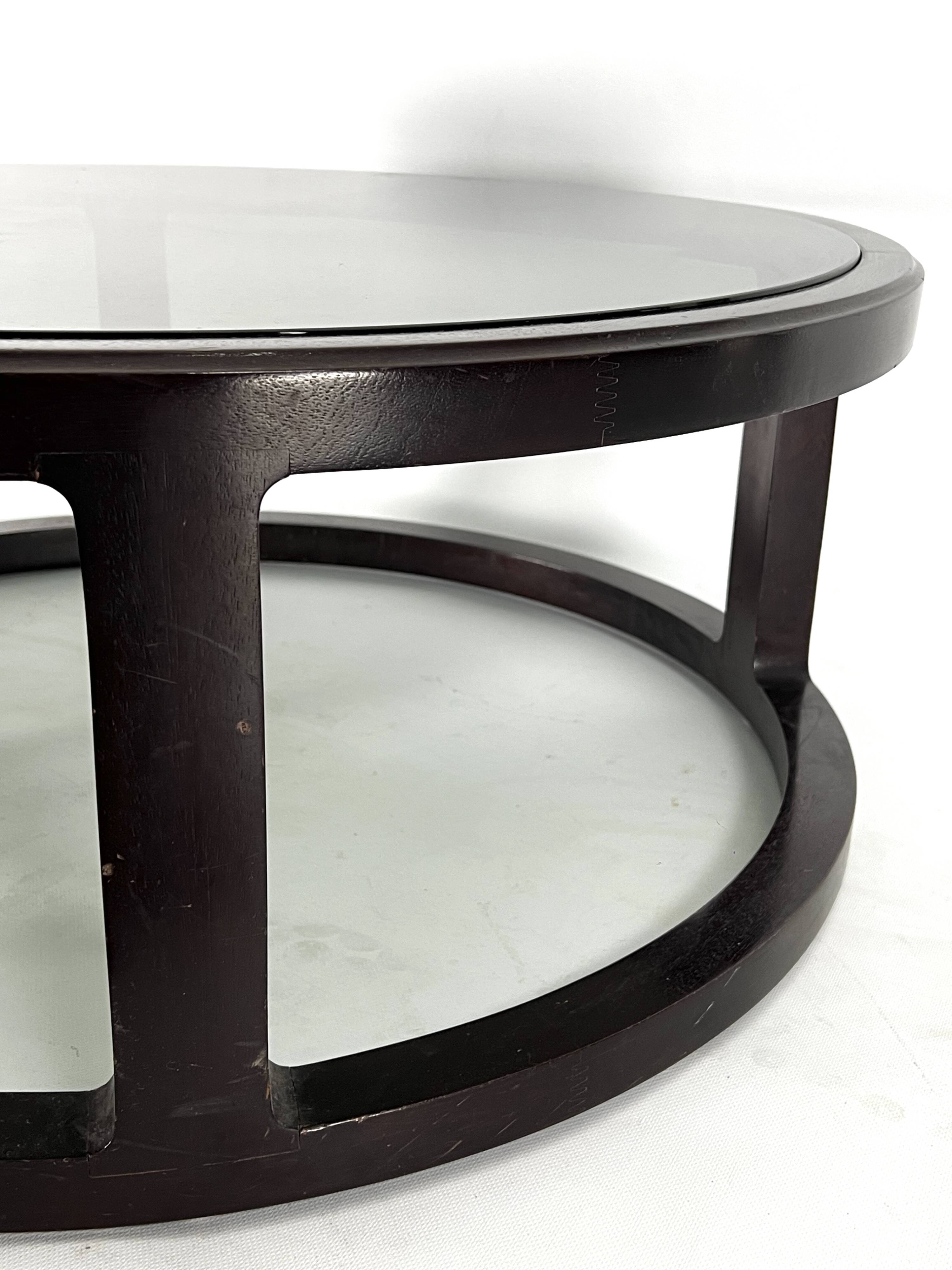 Italian Vintage Large Round coffee table in wood and fume glass. 1970s