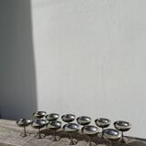 10 stainless steel cups signed Rémy Letang