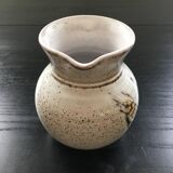 Signed pitcher with thistle decoration