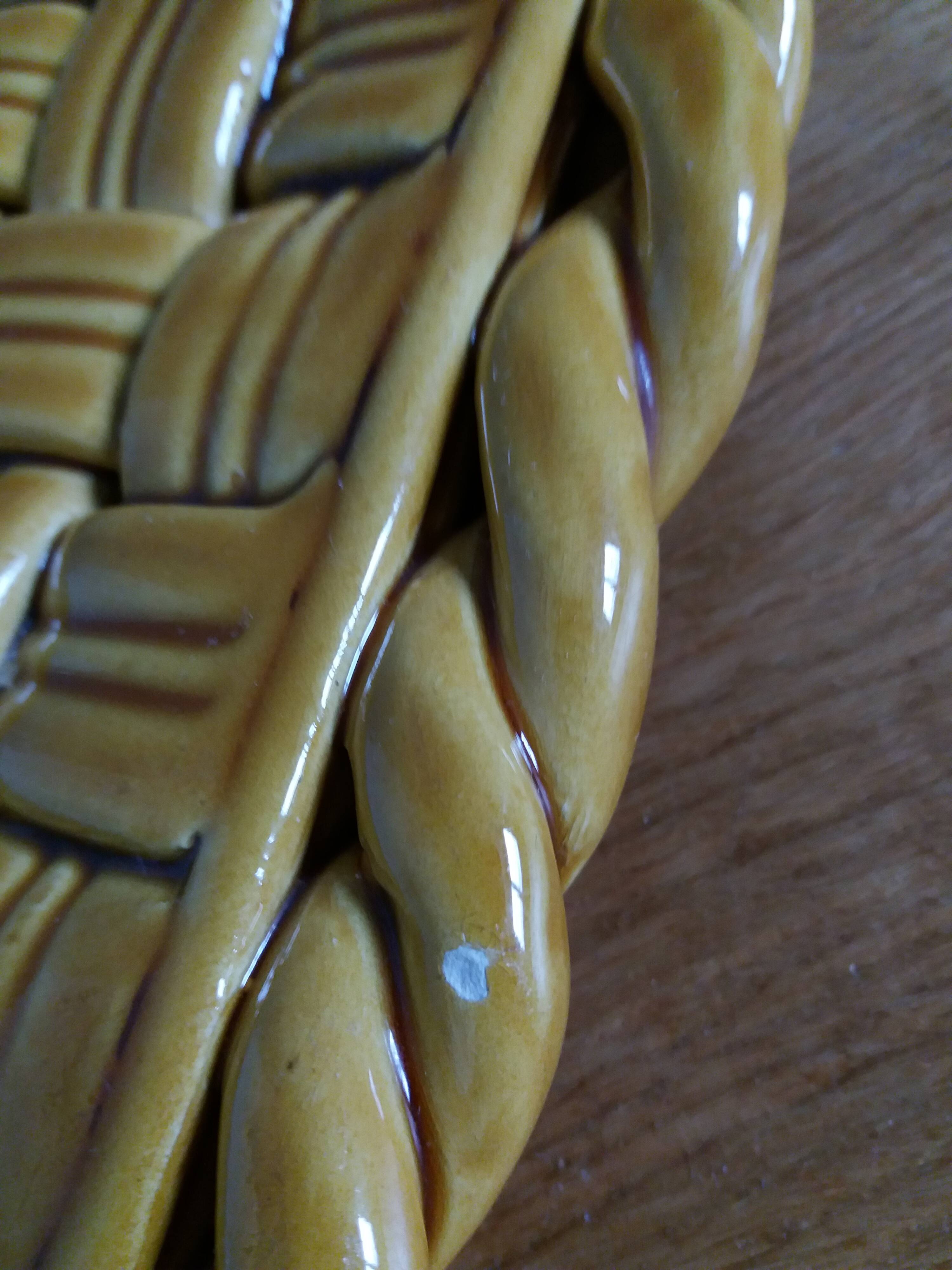 Openwork woven ceramic trivet