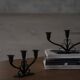Early 20th century, pair of Danish Art Deco candlesticks in metal with three arms, 1930s.