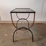 Vintage cast iron and black glass side table