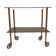 Vintage rolling dessert trolley with smoked glass trays and a golden base.