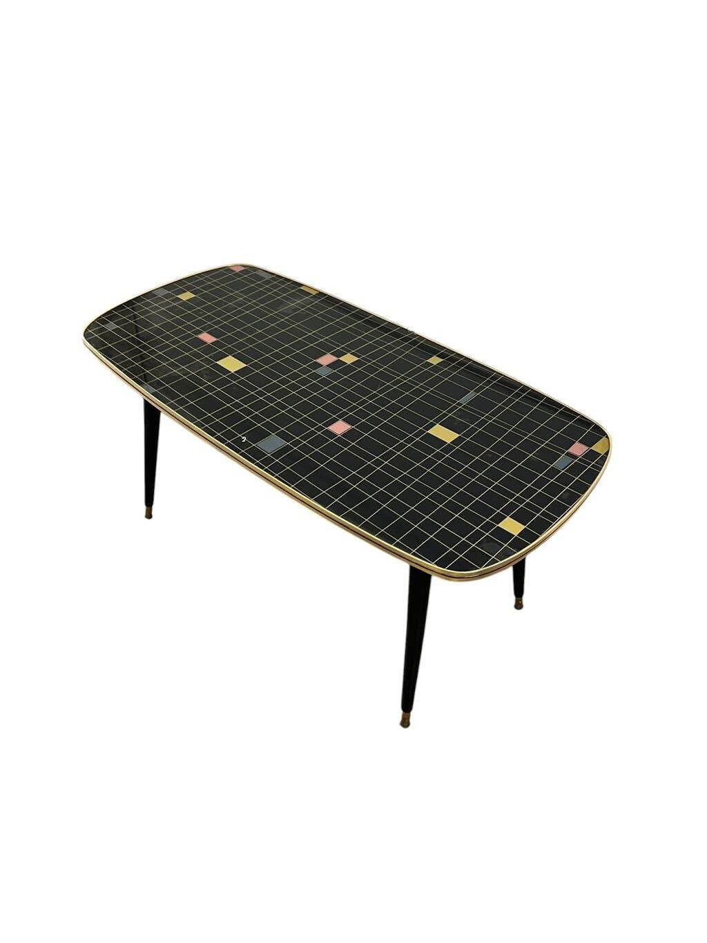 Table basse vintage en formica noir et or