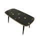 Table basse vintage en formica noir et or