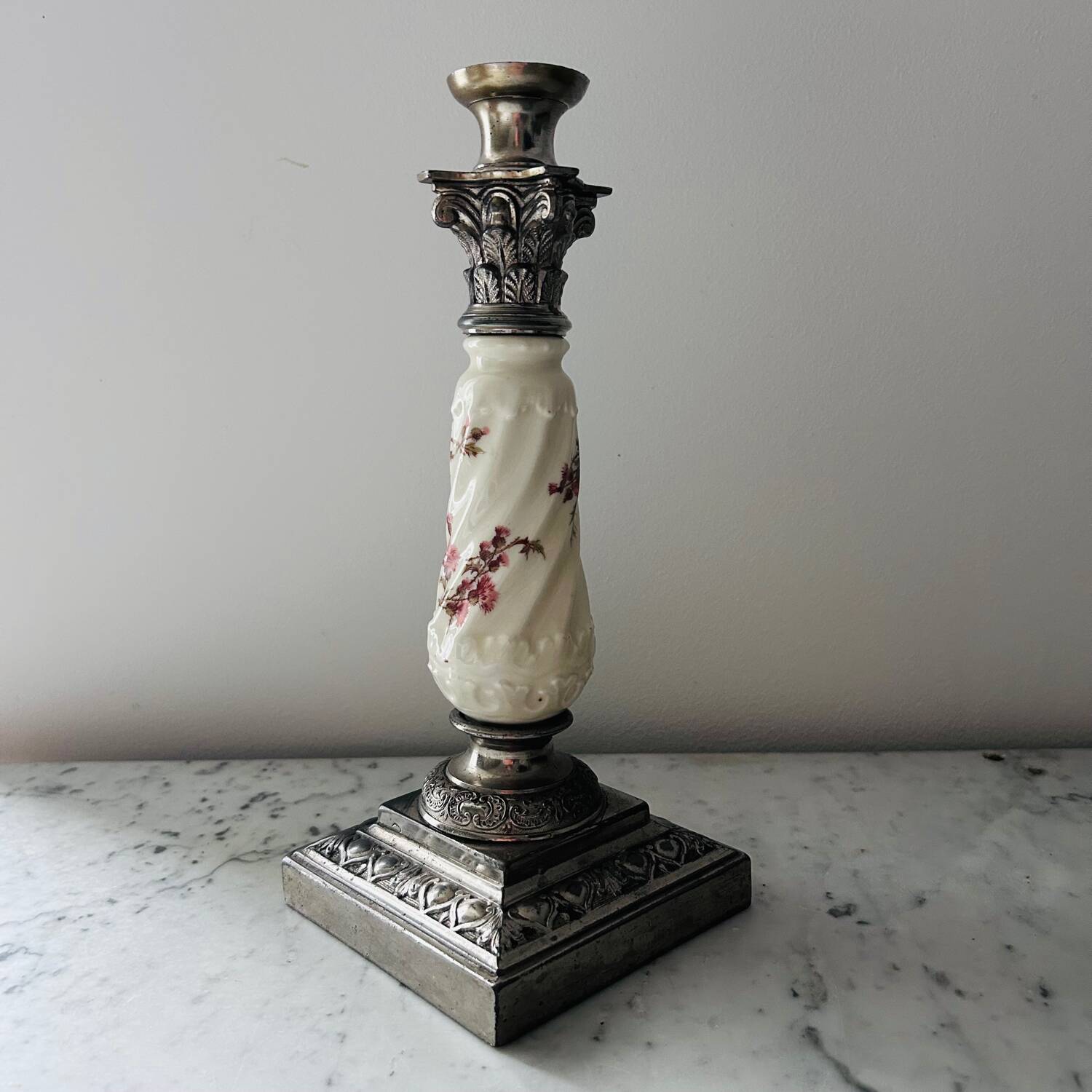 Silver-plated metal and porcelain candlestick