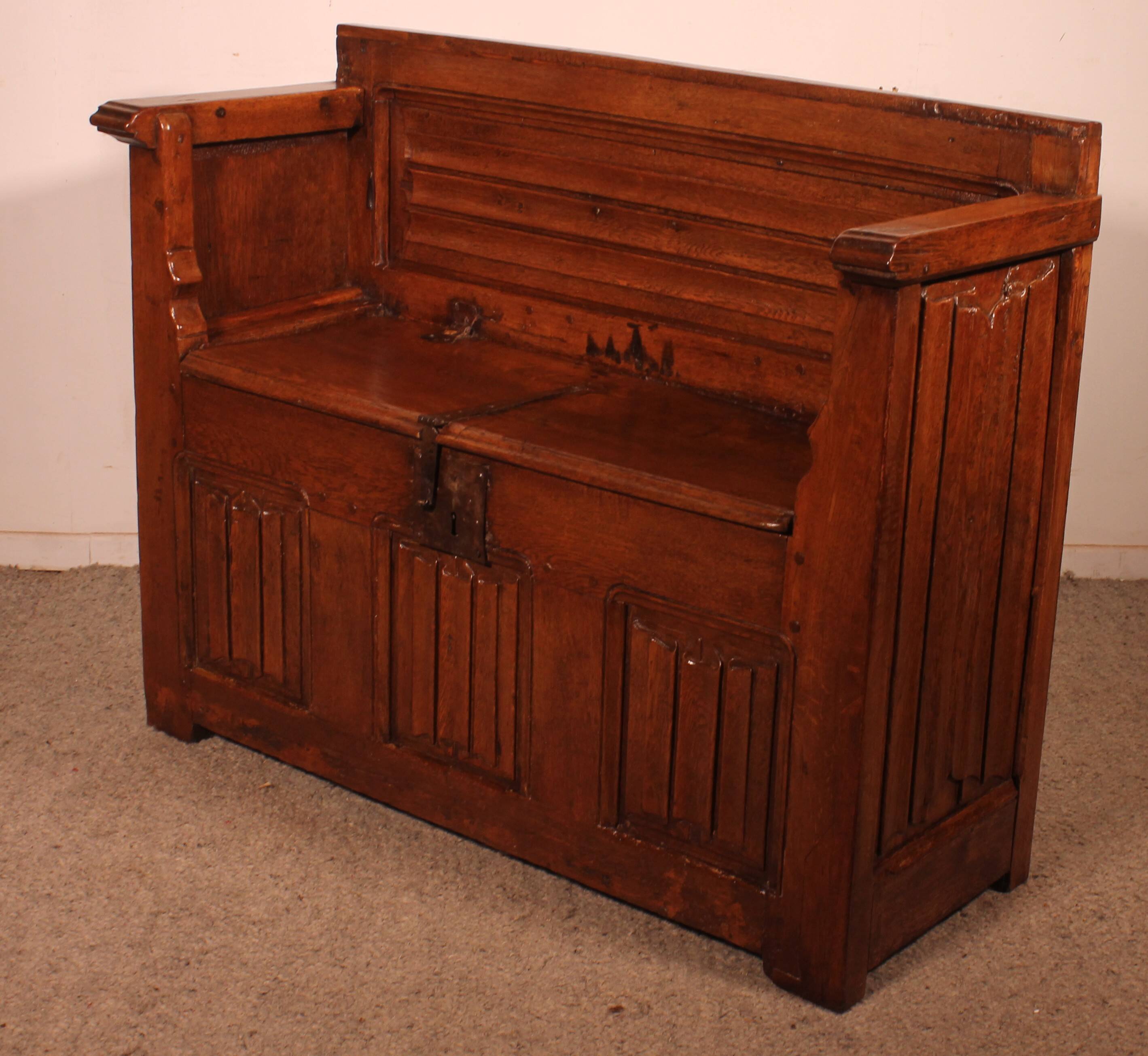 Oak bench chest with incorporated panels and gothic elements