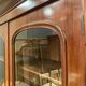 English showcase in two mahogany bodies and 19th century veneer