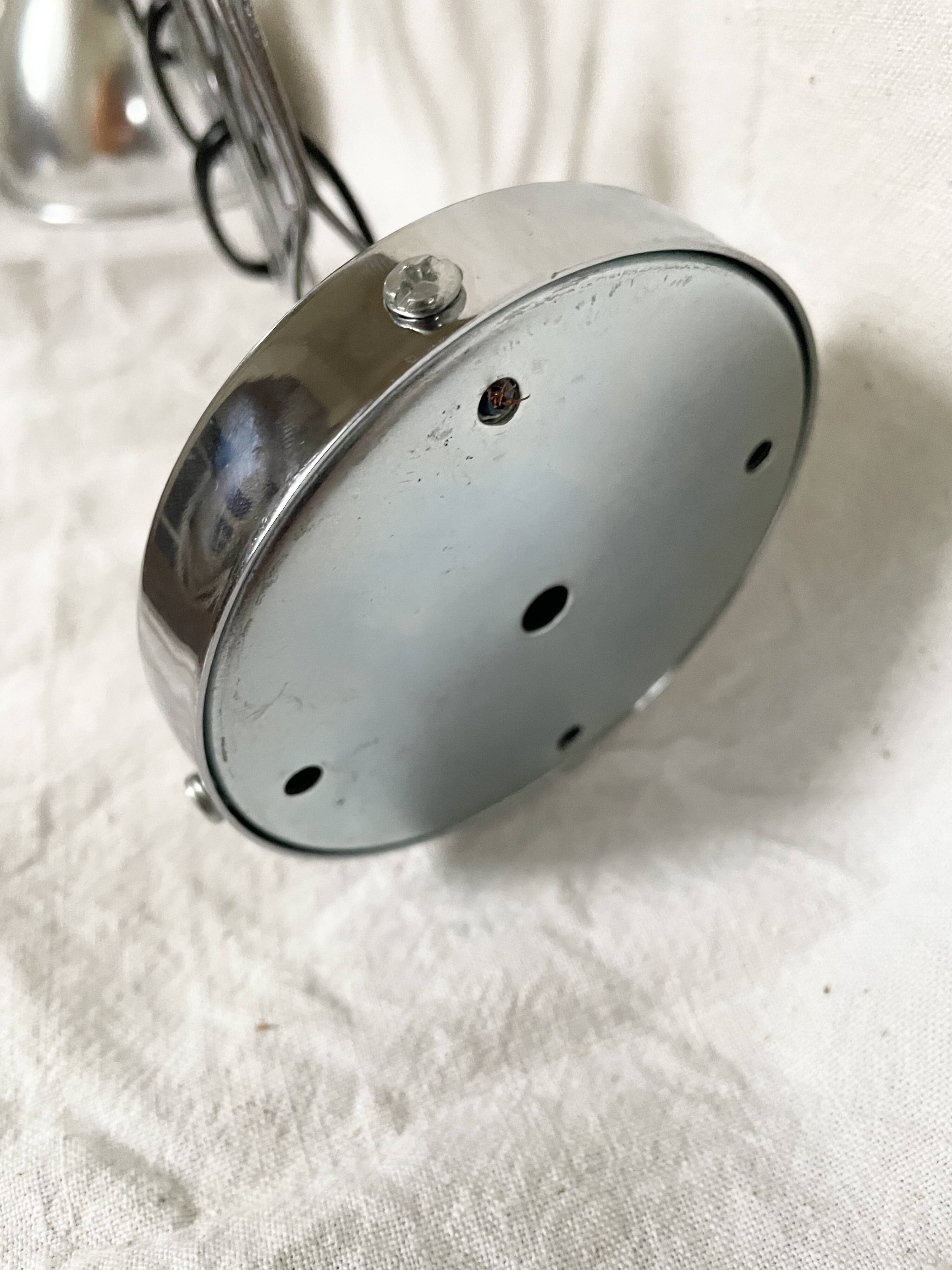 Vintage accordion wall light in chrome metal.