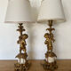 Pair of bronze lamps with puttis
