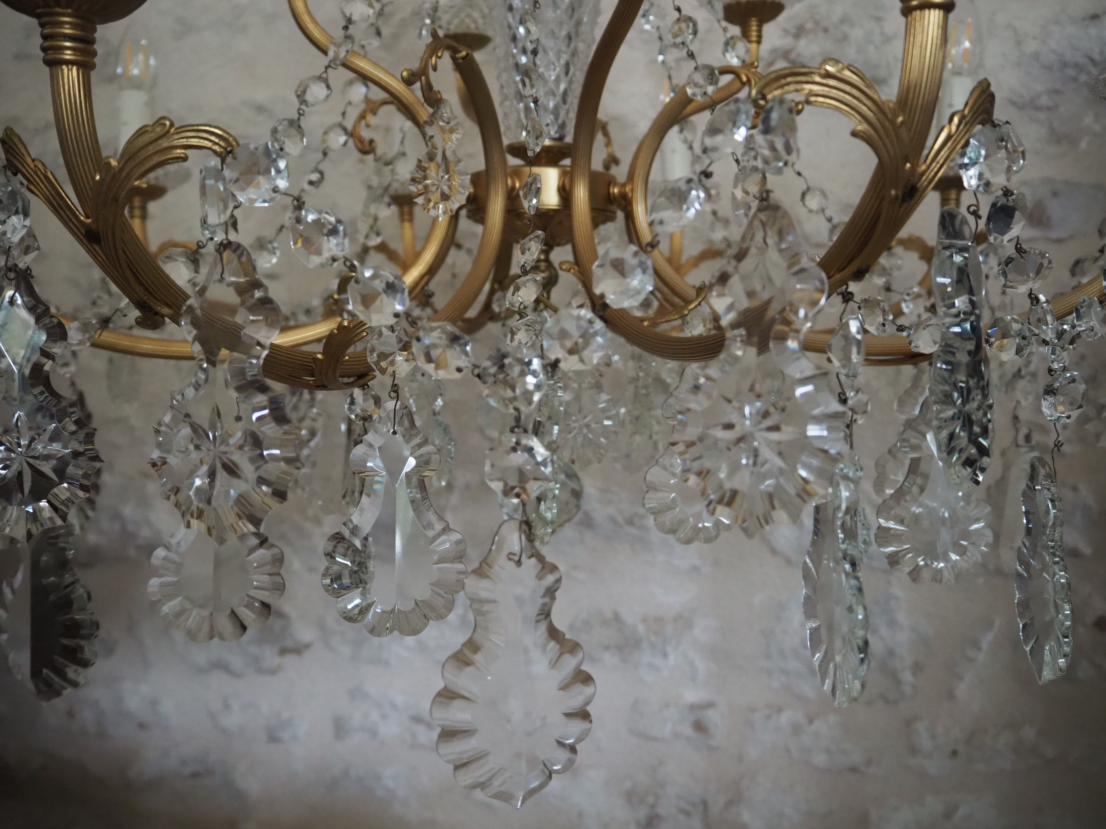 Chandelier 12 lamps with grapevines in crystal, bronze and regulated