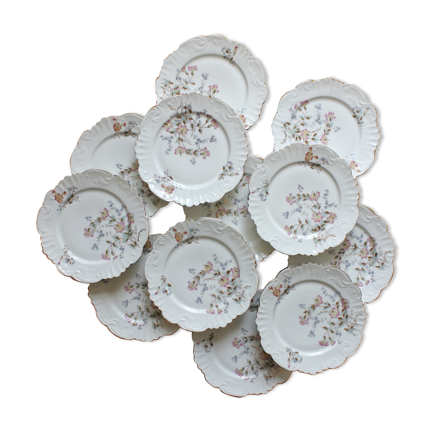 12 assiettes à dessert en porcelaine ancienne décor polychrome floral début XXe