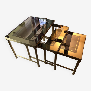 Lot: set of 3 nest of tables in brass and smoked gold glass 1970s