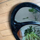 Oval cast steel mirror with Art Nouveau decor