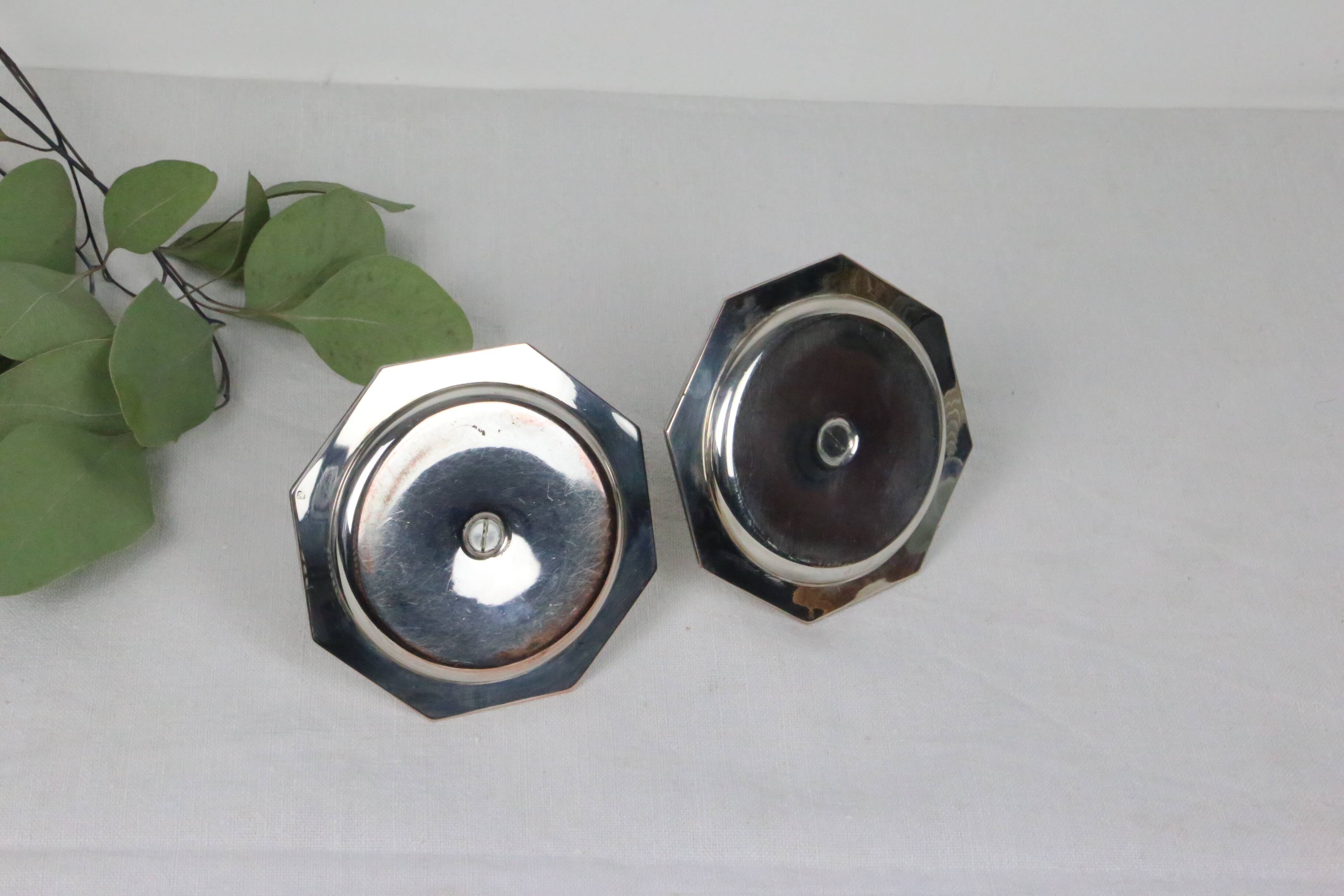 Pair of silver-plated metal candlesticks