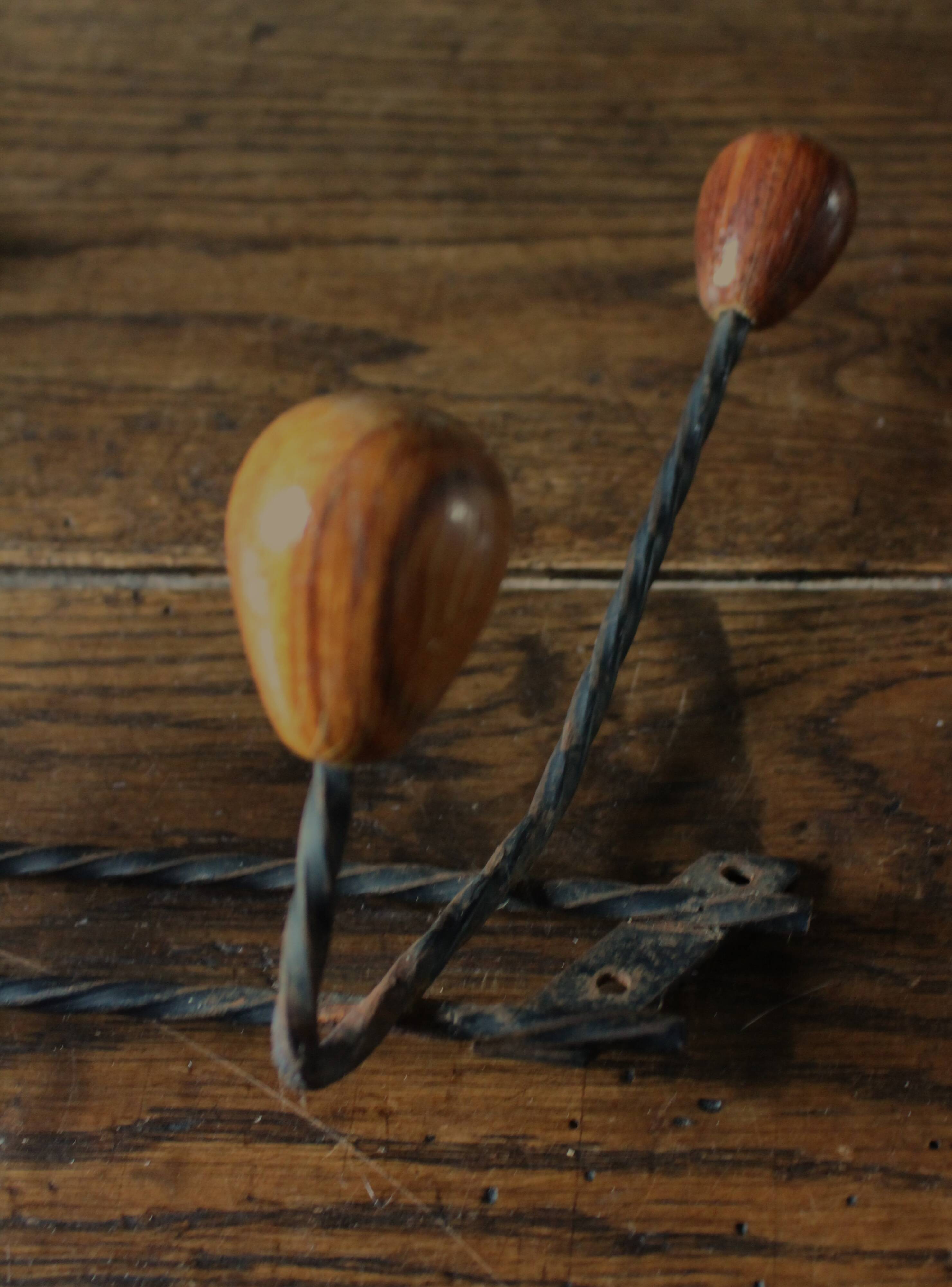 Double wrought iron coat rack with 3 double wooden ball hooks