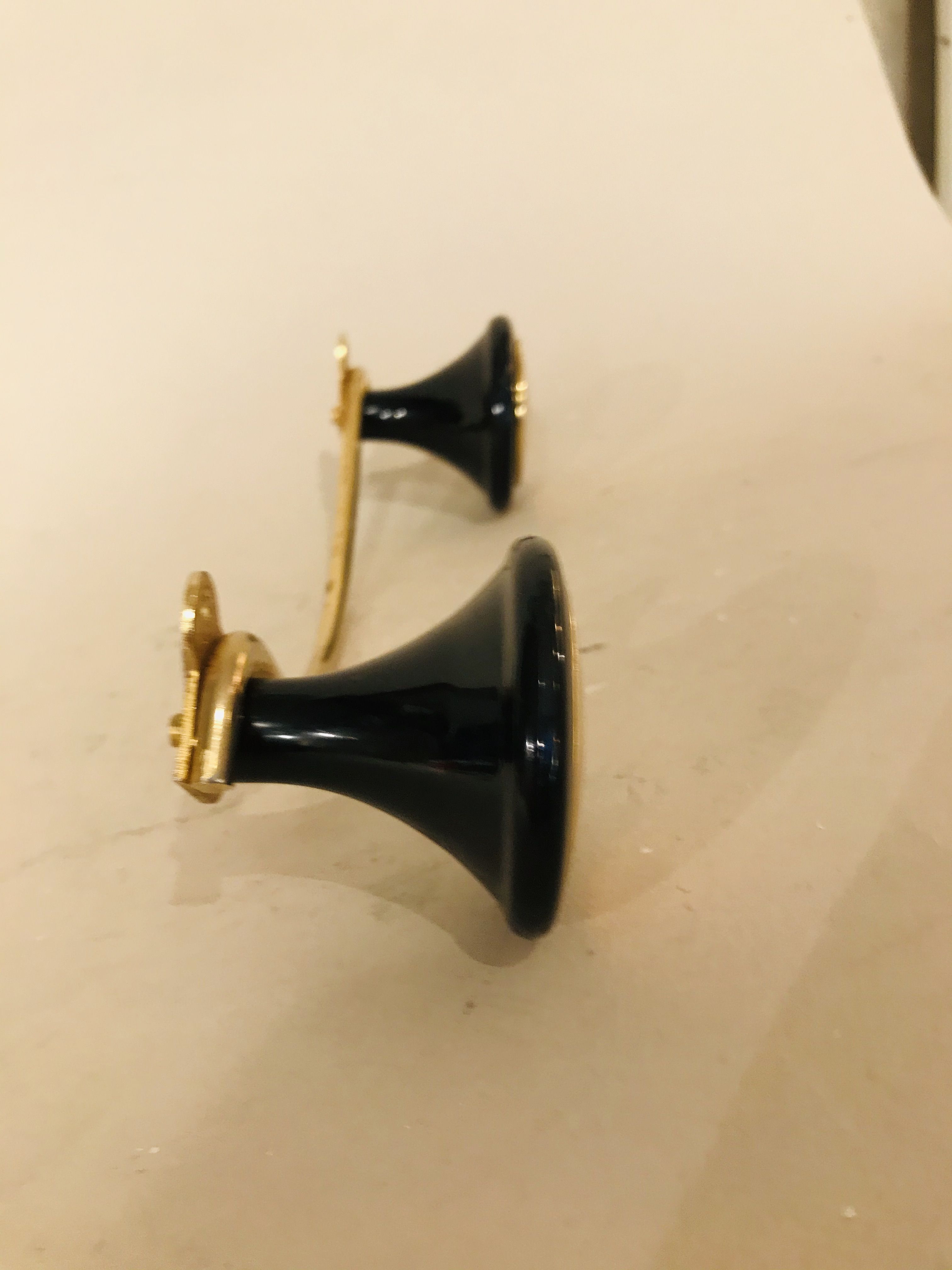 Gold and black metal coatrack 1960