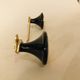 Gold and black metal coatrack 1960