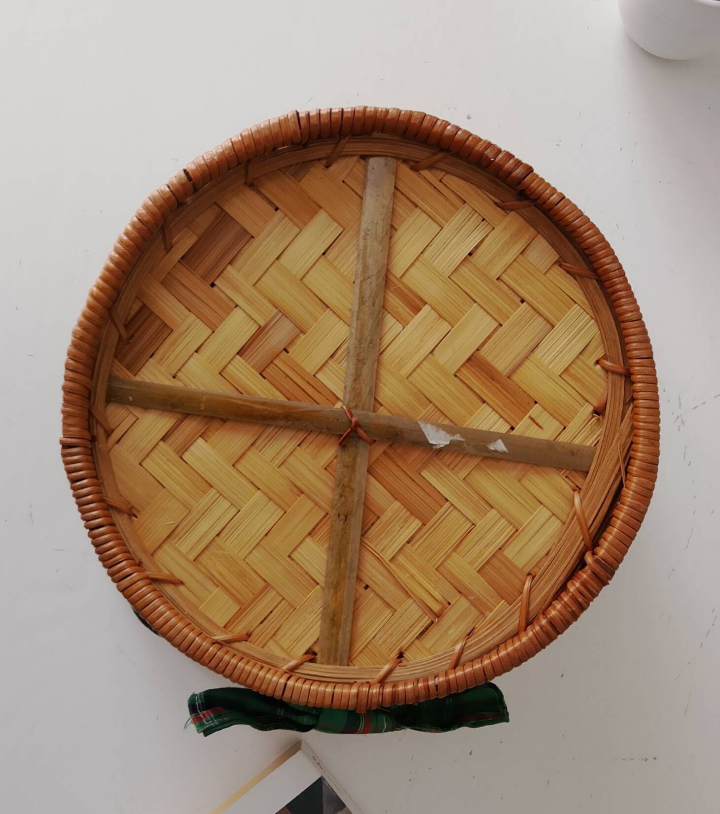 Vintage wicker and rattan basket with tartan fabric.