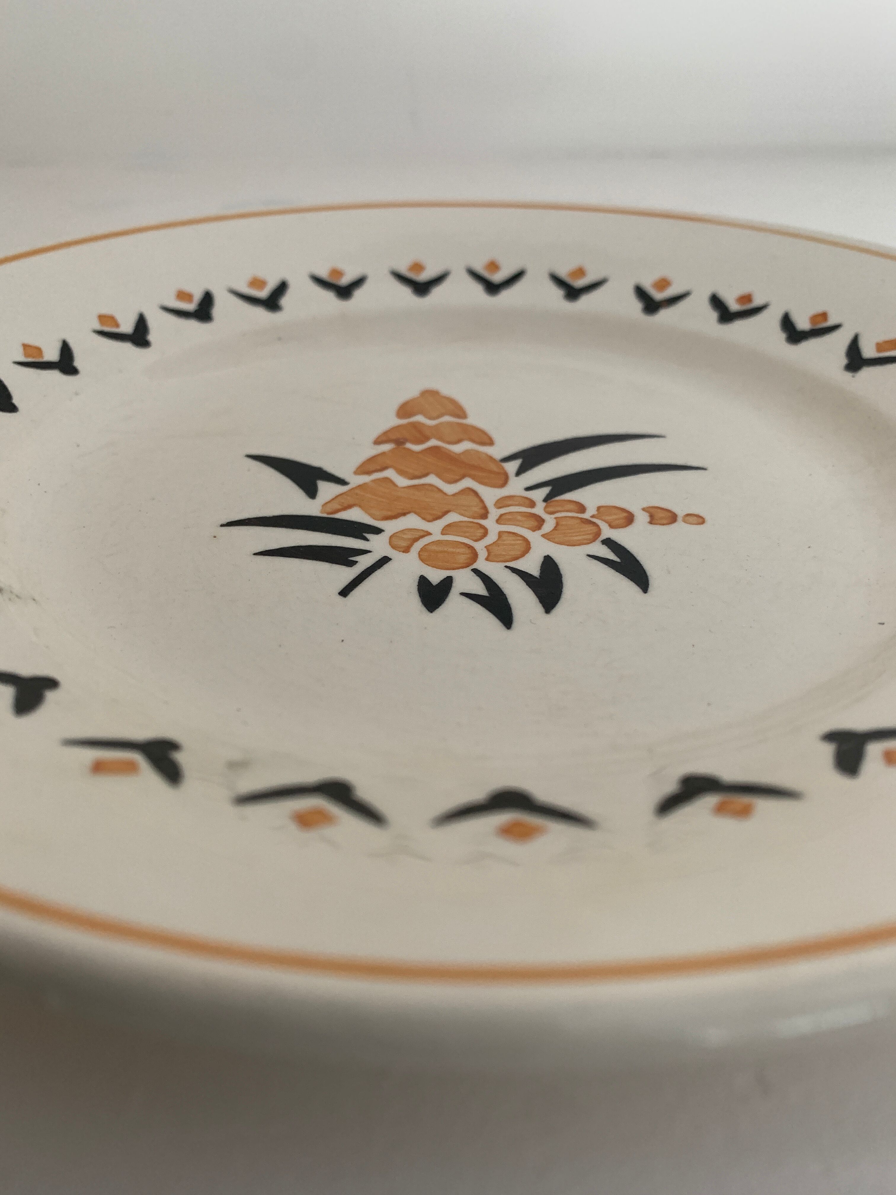 7 dessert plates and one Longwy dish
