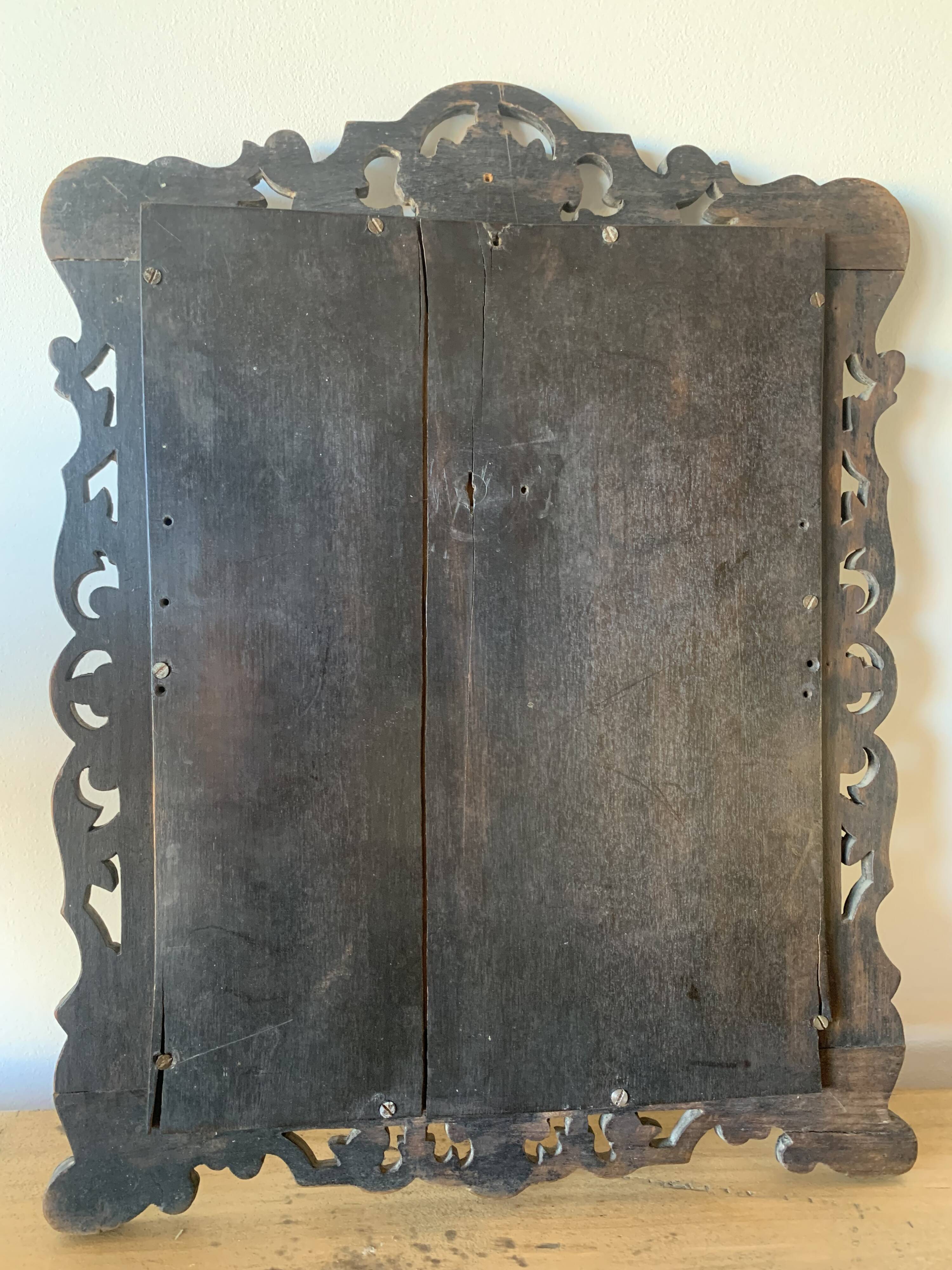Eventful beveled mirror and openwork period 1900 repelled tin decoration