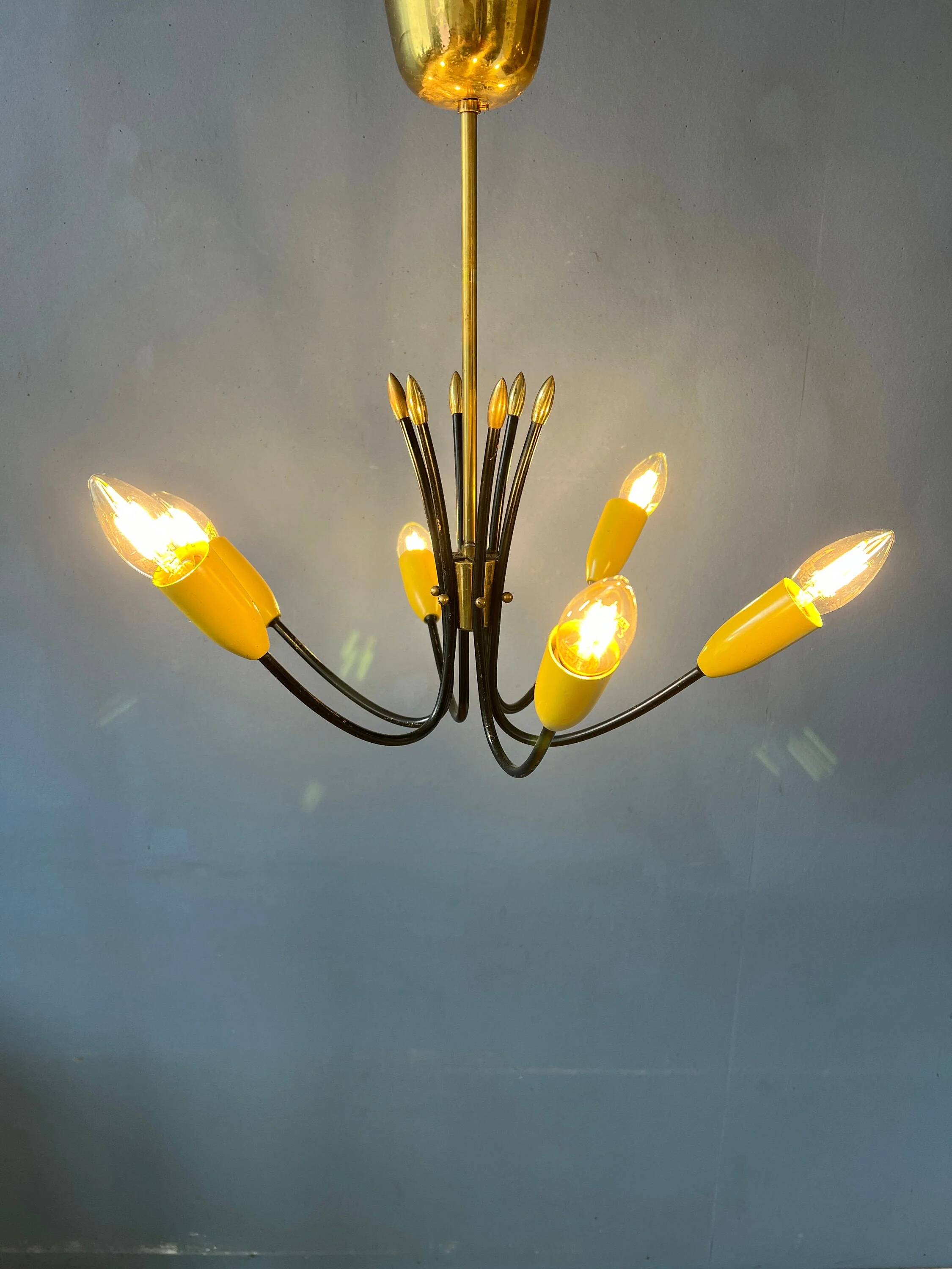 Vintage yellow spider suspension from the 1950s.