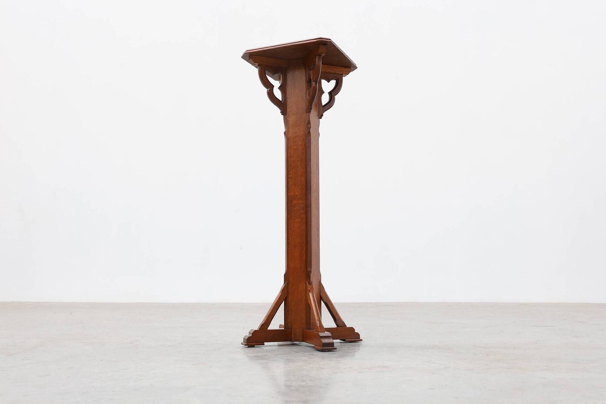 Art Deco oak pedestal with pierced brackets and cross base, Belgium 1920s