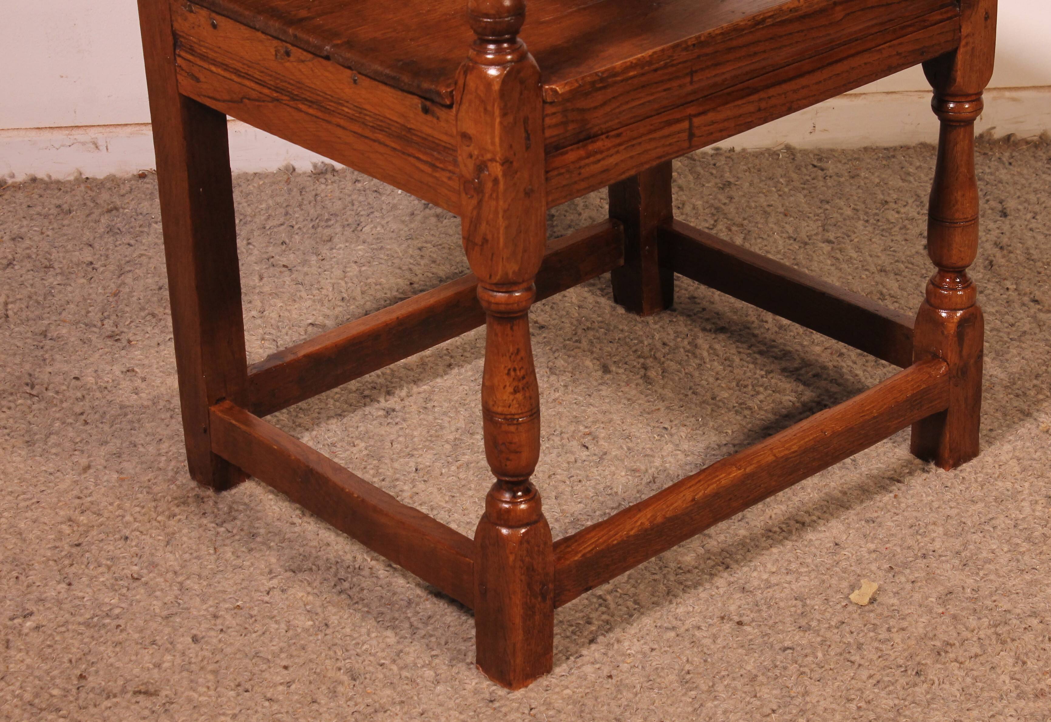 high-backed armchair from the 17th century in oak