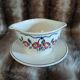 Antique sauce boat in Longchamp ironstone.