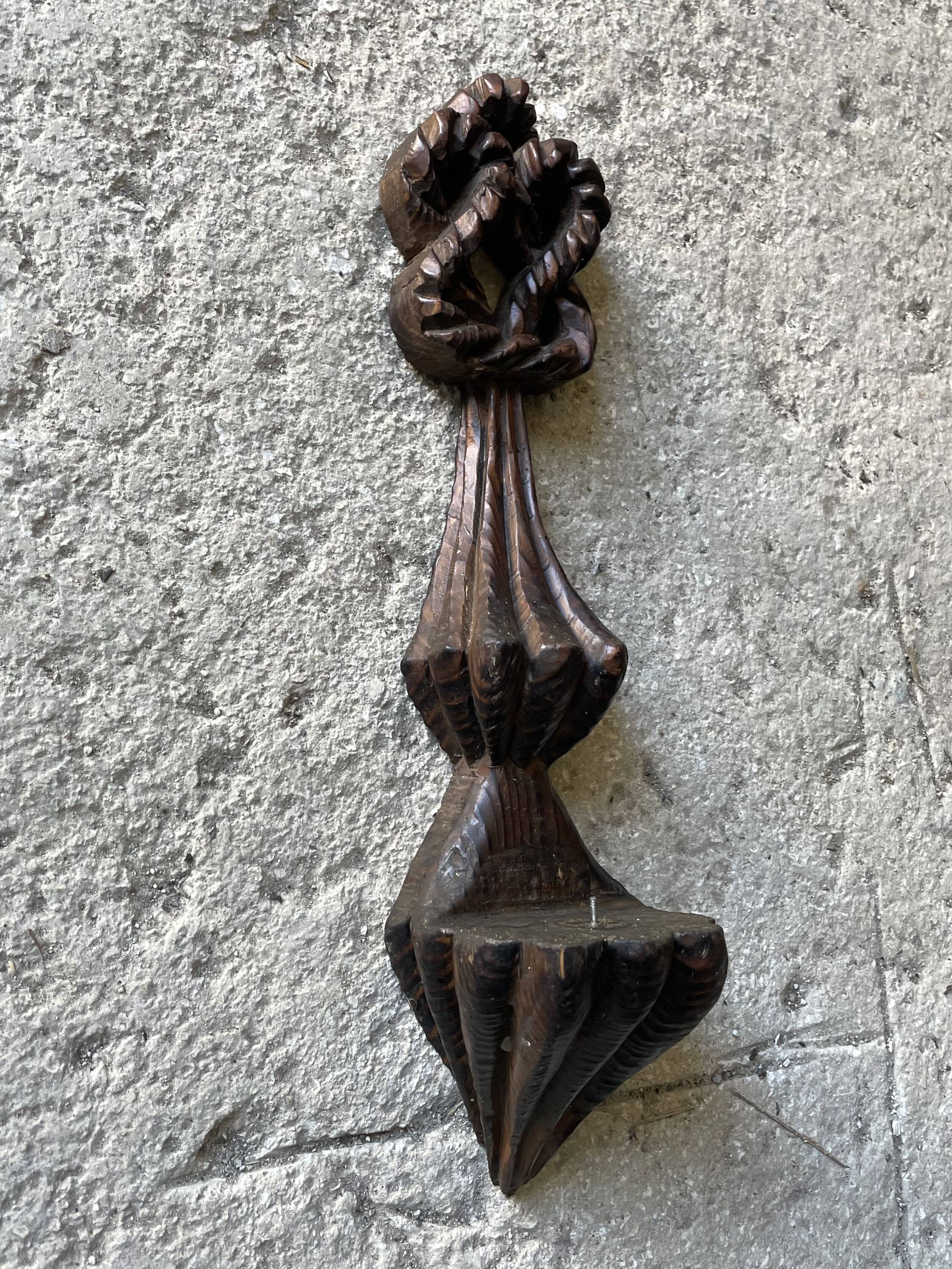 Carved wooden wall candle holder