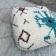 Berber floor pouf: Handwoven Moroccan wool cushion.
