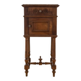 Antique wooden bedside table with a marble top.