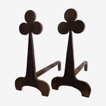 Pair of wrought iron chenets with clover decorations