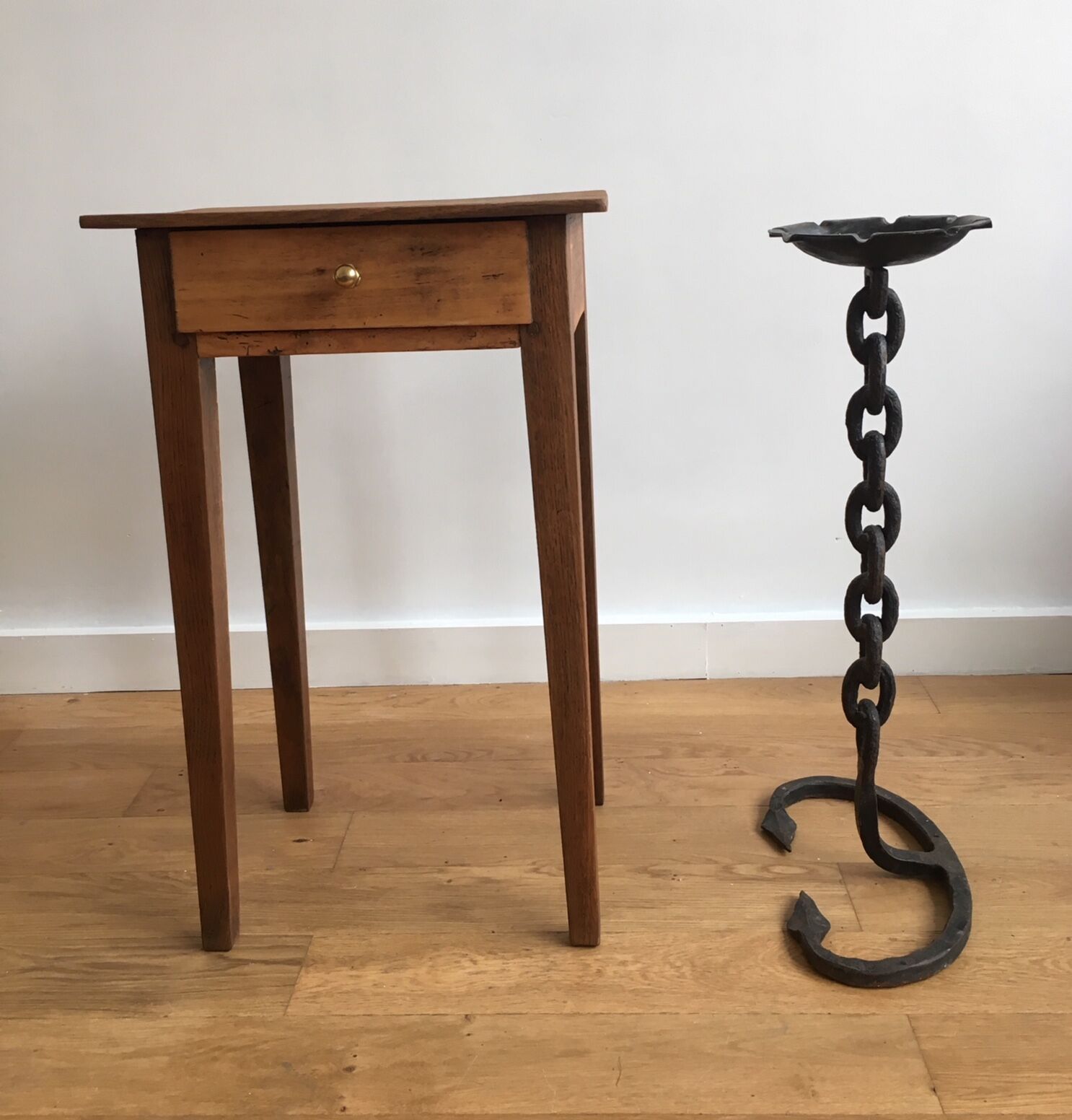 Wrought iron ashtray on its chain and anchor foot
