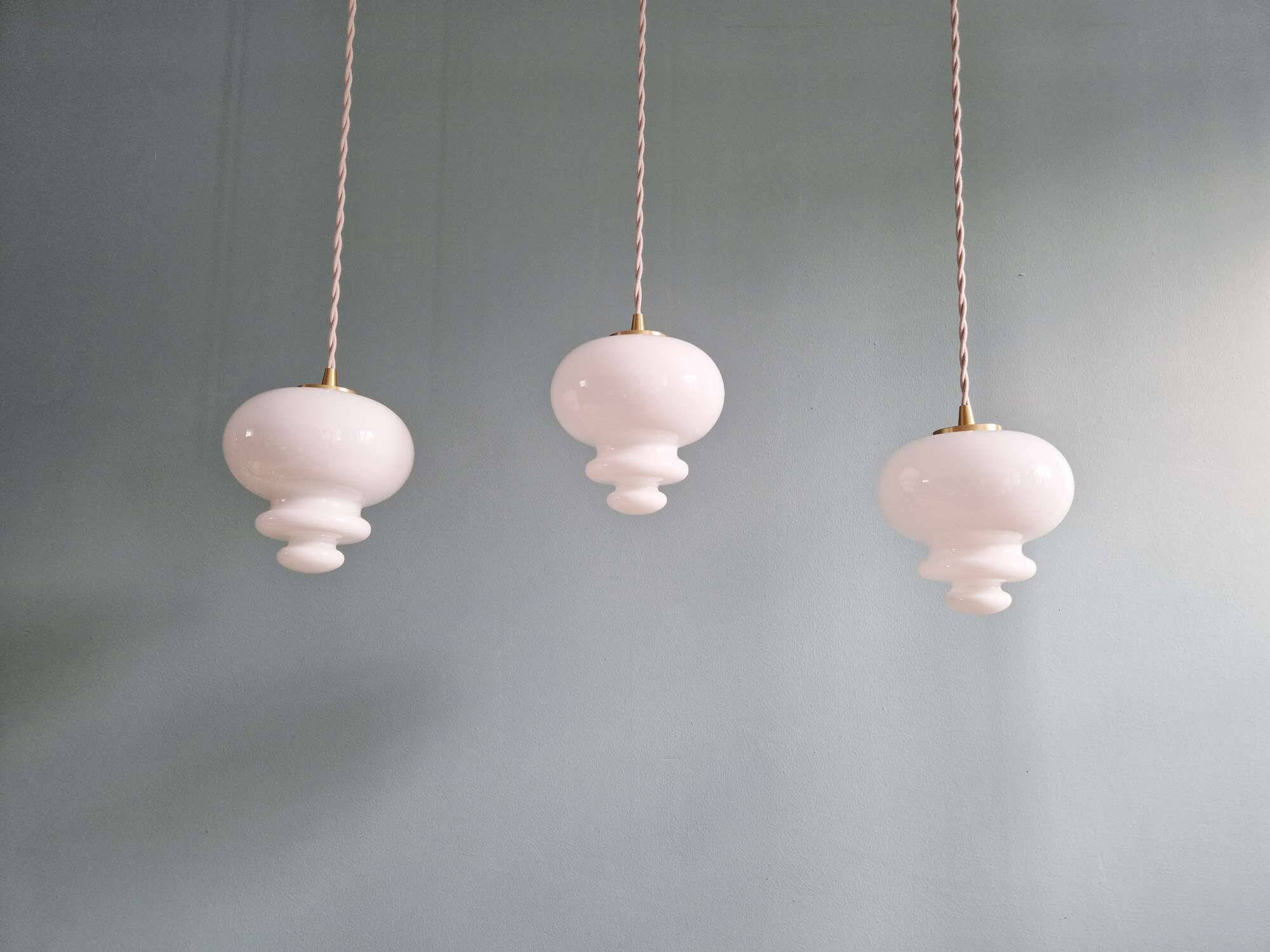 Scandinavian trio of suspensions in white opaline, 1960.