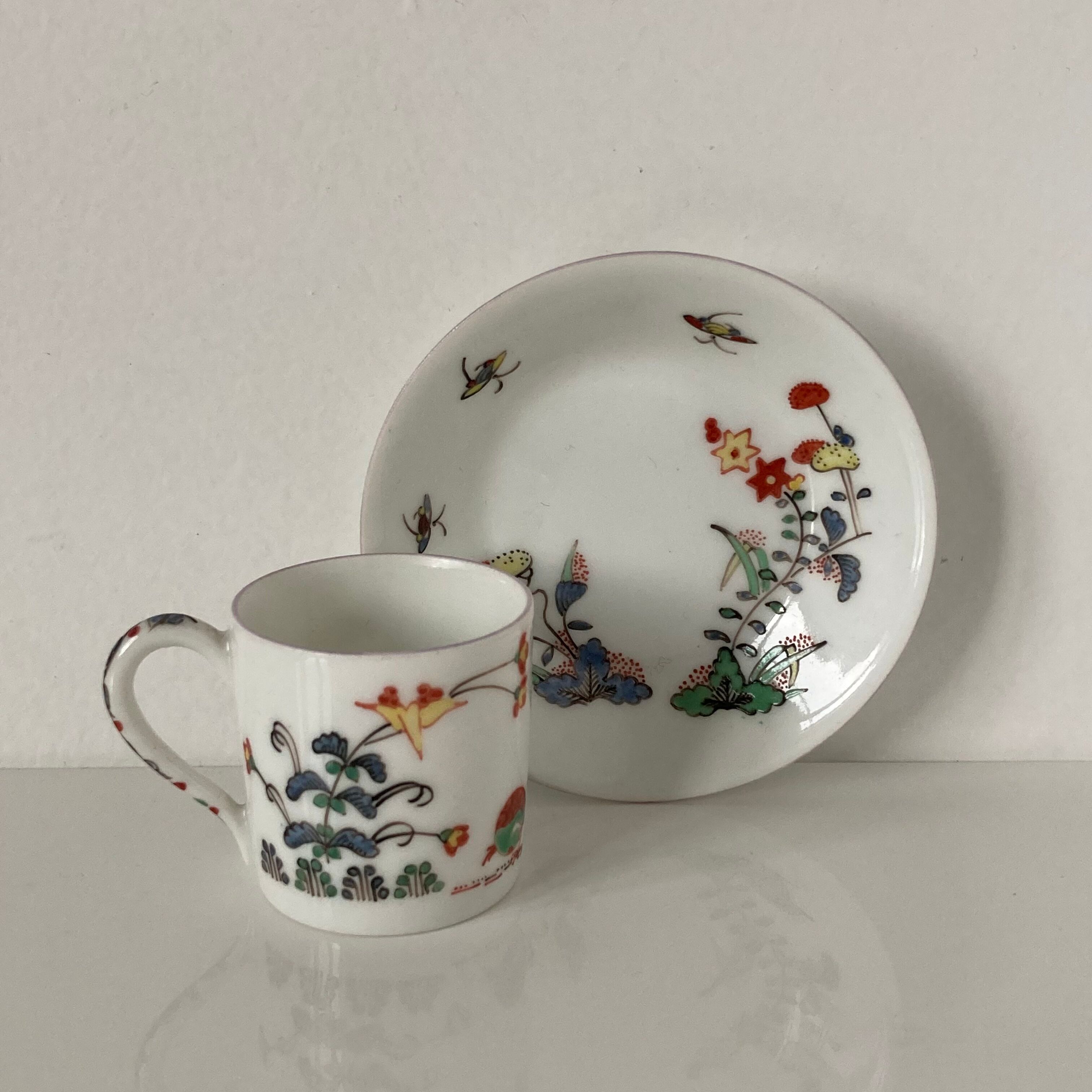 Limoges porcelain cup and sub-cup decorated in Chantilly in the Japanese Kakiemon style