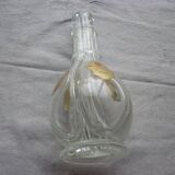A liquor decanter has 4 compartments in glass
