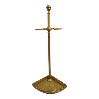 Old brass umbrella door triangular base mounted on column