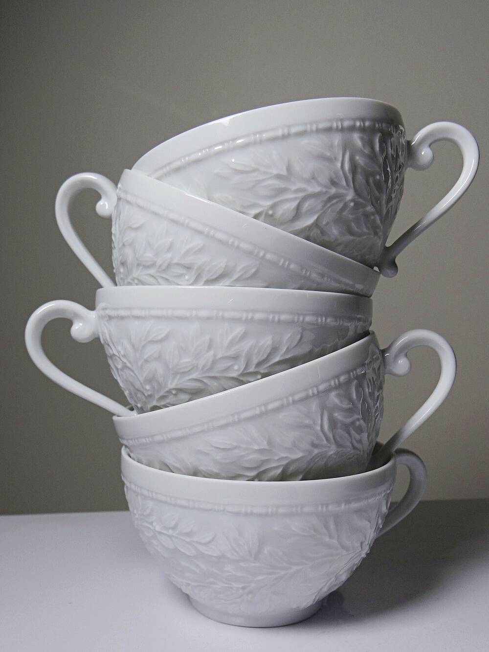 Set of 6 Bernardaud Limoges Louvre model white porcelain cups.