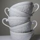 Set of 6 Bernardaud Limoges Louvre model white porcelain cups.