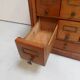 Antique oak watchmakers cabinet with drawers