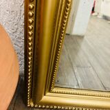 Antique gilded mirror in old Louis Philippe wood