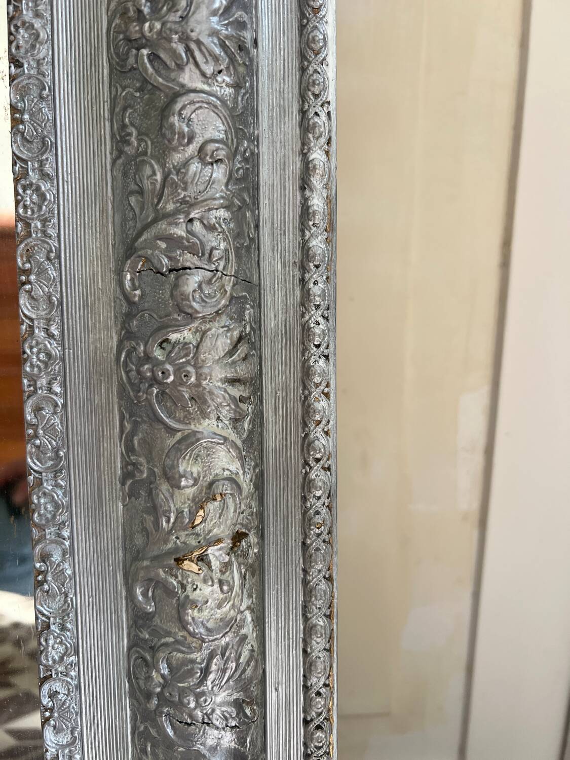 Antique mirror in stucco and wood
