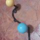 Vintage wall coat rack "Atomic" in wrought iron with multicoloured balls.