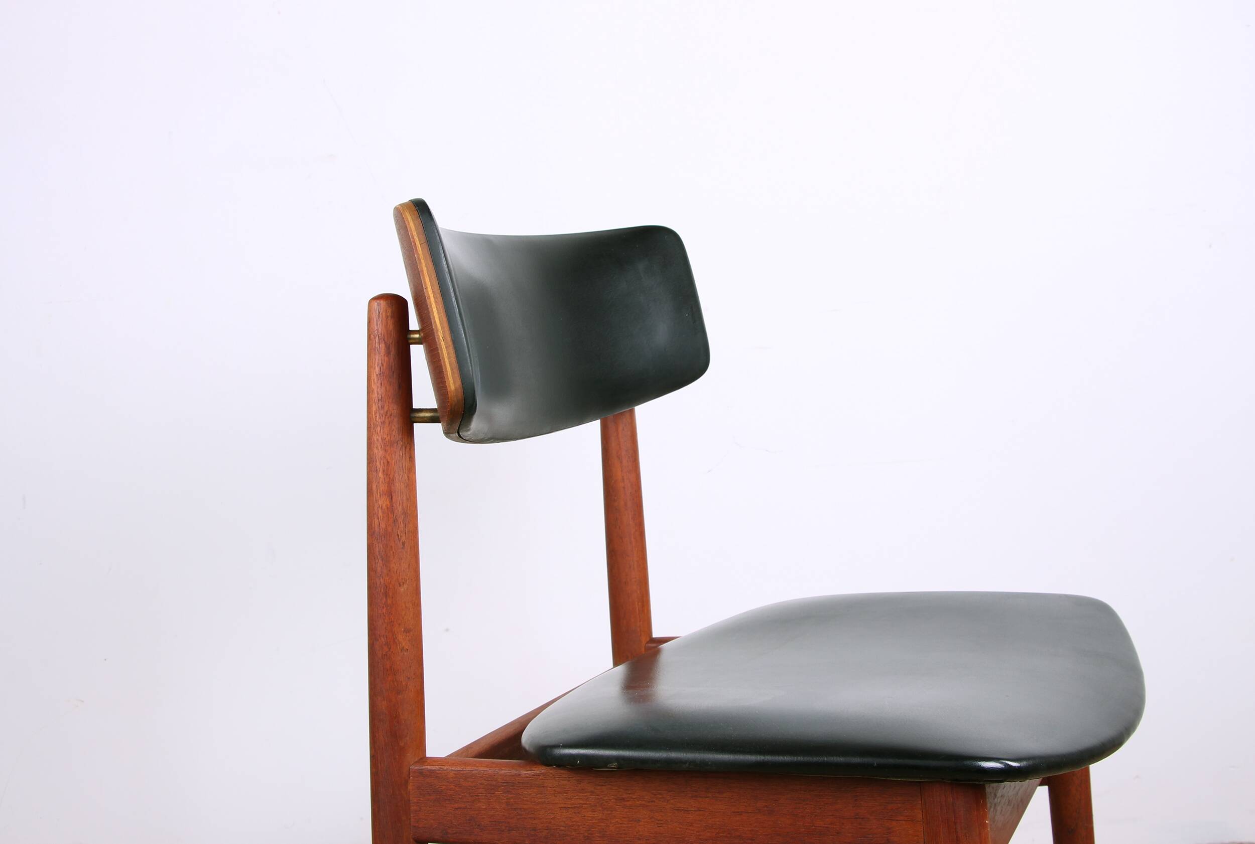 Set of 4 Danish chairs in teak, black skai and brass by Sax 1960.